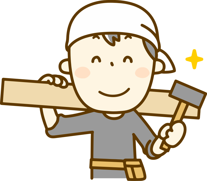 eine Person beim Bauen mit Hammer und Holzbrett